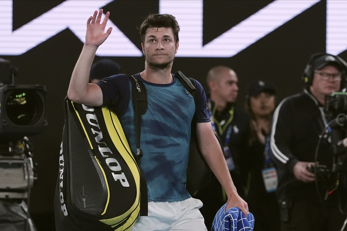 Miomir Kecmanovic of Serbia waves as he leaves Rod Laver Arena following his fourth round loss to Carlos Alcaraz of Spain during their fourth round match at the Australian Open tennis championships at Melbourne Park, Melbourne, Australia, Monday, Jan. 22, 2024. (AP Photo/Andy Wong)