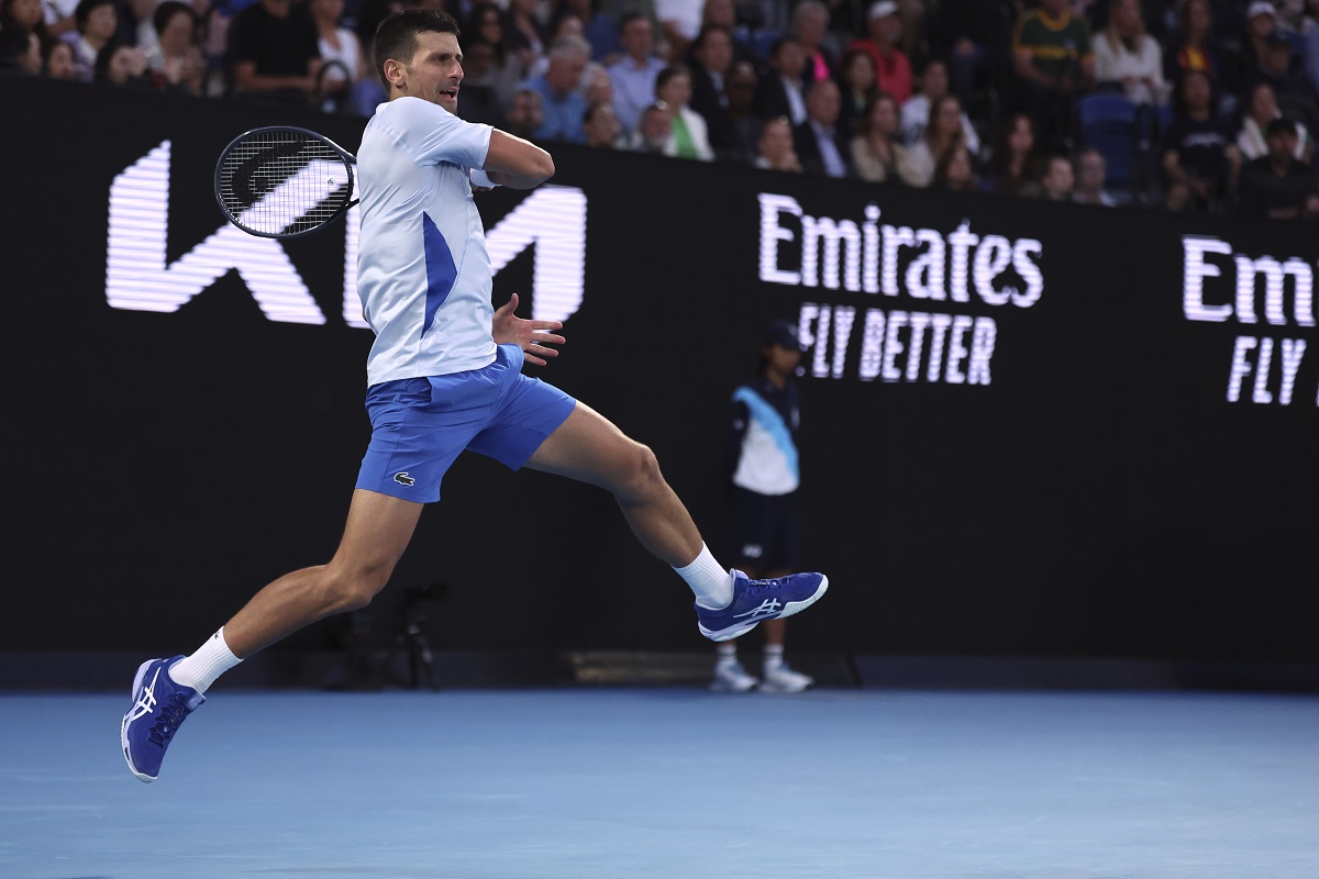 Novak Djokovic of Serbia plays a forehand return to Tomas Martin Etcheverry of Argentina during their third round match at the Australian Open tennis championships at Melbourne Park, Melbourne, Australia, Friday, Jan. 19, 2024. (AP Photo/Asanka Brendon Ratnayake)