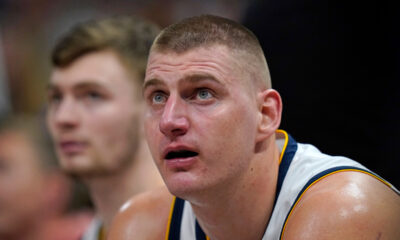 Denver Nuggets center Nikola Jokic looks sits on the bench during the second half of the team's NBA basketball game against the Utah Jazz on Wednesday, Jan. 10, 2024, in Salt Lake City. (AP Photo/Rick Bowmer)