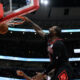 Chicago Bulls' Andre Drummond, top, dunks during the second half of an NBA basketball game against the Philadelphia 76ers, Saturday, Dec. 30, 2023, in Chicago. (AP Photo/Paul Beaty)