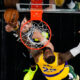 Atlanta Hawks guard Bogdan Bogdanovic (13) has his shot blocked by Los Angeles Lakers forward LeBron James (23) in the second half of an NBA basketball game Tuesday, Jan. 30, 2024, in Atlanta. (AP Photo/John Bazemore)