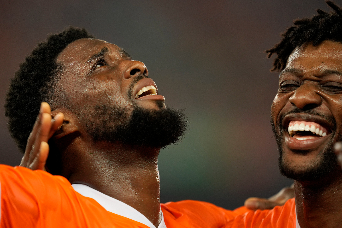 Ivory Coast's Jean-Philippe Krasso, left, celebrates with teammate after scoring his team second goal during the African Cup of Nations Group A soccer match between Ivory Coast and Guinea-Bissau in Abidjan, Ivory Coast, Saturday, Jan. 13, 2024. (AP Photo/Sunday Alamba)