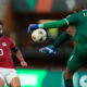 Egypt's Mohamed Salah, left, watches a Mozambique's goalkeeper Hernâni Siluane kicks the ball clear during the African Cup of Nations Group B soccer match between Egypt and Mozambique in Abidjan, Ivory Coast, Sunday, Jan. 14, 2024. (AP Photo/Themba Hadebe)