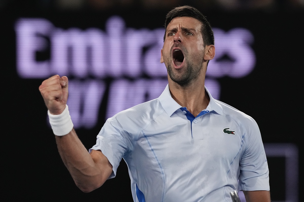 Serbia's Novak Djokovic celebrates after winning the third set against Croatia's Dino Prizmic during their first round match at the Australian Open tennis championships at Melbourne Park, Melbourne, Australia, Sunday, Jan. 14, 2024. (AP Photo/Andy Wong)