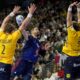 Sweden's Max Darj and Sweden's Jonathan Carlsbogard fail to prevent France's Nikola Karabatic from scoring during the Handball European Championship semifinal match between France and Sweden in Cologne, Germany, Friday, Jan. 26, 2024. (AP Photo/Martin Meissner)