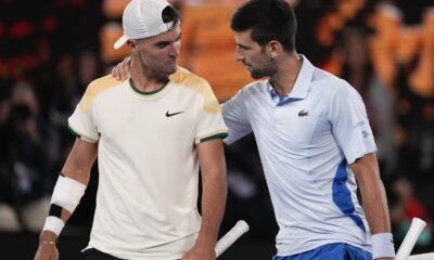 Serbia's Novak Djokovic, right, is congratulated by Croatia's Dino Prizmic following their first round match at the Australian Open tennis championships at Melbourne Park, Melbourne, Australia, Sunday, Jan. 14, 2024. (AP Photo/Alessandra Tarantino)