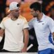 Serbia's Novak Djokovic, right, is congratulated by Croatia's Dino Prizmic following their first round match at the Australian Open tennis championships at Melbourne Park, Melbourne, Australia, Sunday, Jan. 14, 2024. (AP Photo/Alessandra Tarantino)