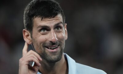 Serbia's Novak Djokovic reacts during his first round match against Croatia's Dino Prizmic at the Australian Open tennis championships at Melbourne Park, Melbourne, Australia, Sunday, Jan. 14, 2024. (AP Photo/Alessandra Tarantino)