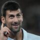 Serbia's Novak Djokovic reacts during his first round match against Croatia's Dino Prizmic at the Australian Open tennis championships at Melbourne Park, Melbourne, Australia, Sunday, Jan. 14, 2024. (AP Photo/Alessandra Tarantino)