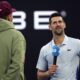 Novak Djokovic, right, of Serbia is interviewed by Nick Kyrgios following his win over Taylor Fritz of the U.S. in their quarterfinal match at the Australian Open tennis championships at Melbourne Park, Melbourne, Australia, Tuesday, Jan. 23, 2024. (AP Photo/Asanka Brendon Ratnayake)