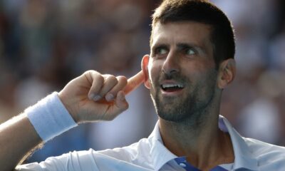 Novak Djokovic of Serbia reacts during his quarterfinal against Taylor Fritz of the U.S. at the Australian Open tennis championships at Melbourne Park, Melbourne, Australia, Tuesday, Jan. 23, 2024. (AP Photo/Asanka Brendon Ratnayake)
