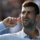 Novak Djokovic of Serbia reacts during his quarterfinal against Taylor Fritz of the U.S. at the Australian Open tennis championships at Melbourne Park, Melbourne, Australia, Tuesday, Jan. 23, 2024. (AP Photo/Asanka Brendon Ratnayake)