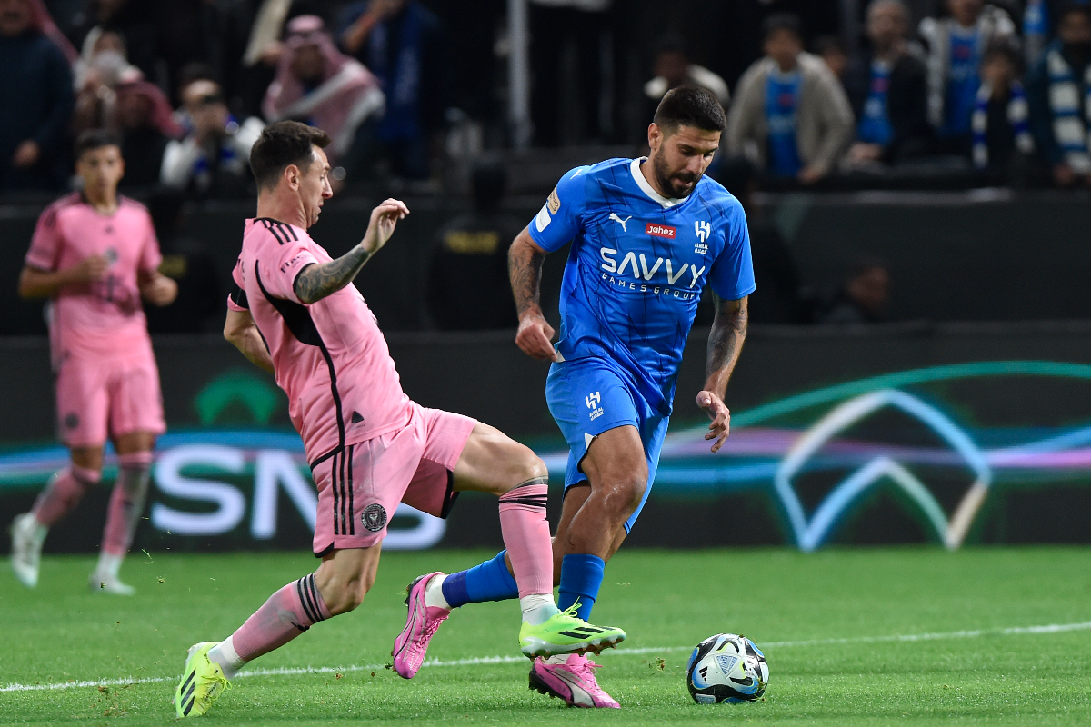 Inter Miami's Lionel Messi, left, in action during the Riyadh Season Cup soccer match between Inter Miami and Al Hilal at Kingdom Arena Stadium in Riyadh, Saudi Arabia, Monday, Jan. 29, 2024. (AP Photo)