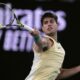 Carlos Alcaraz of Spain plays a forehand return to Miomir Kecmanovic of Serbia during their fourth round match at the Australian Open tennis championships at Melbourne Park, Melbourne, Australia, Monday, Jan. 22, 2024. (AP Photo/Andy Wong)