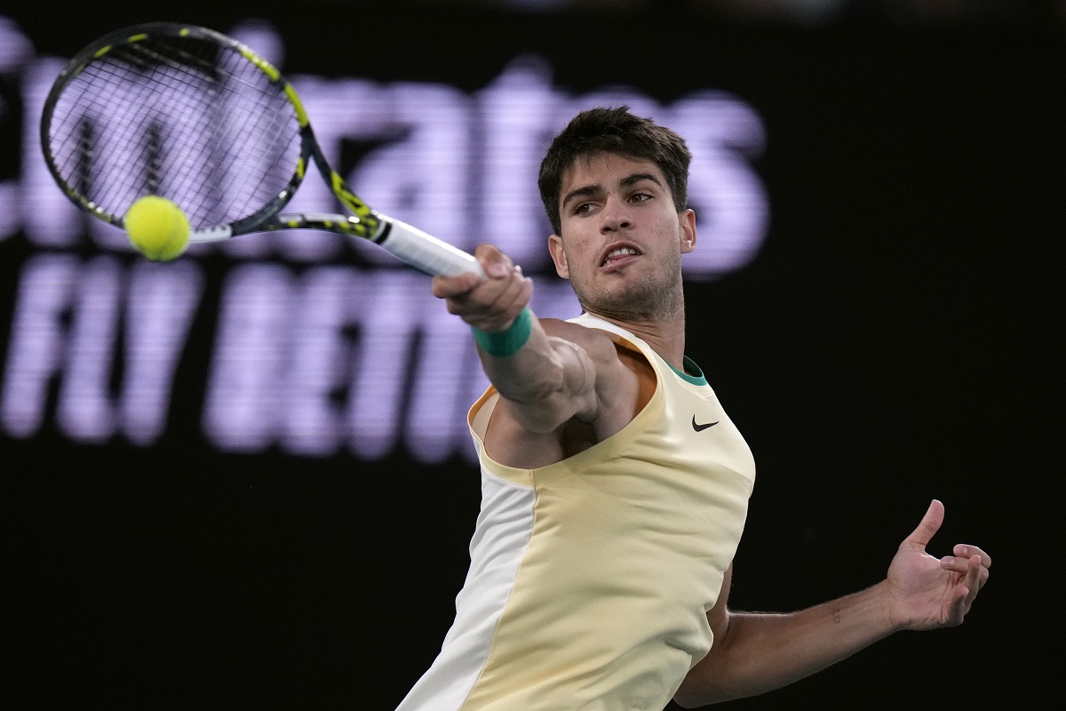 Carlos Alcaraz of Spain plays a forehand return to Miomir Kecmanovic of Serbia during their fourth round match at the Australian Open tennis championships at Melbourne Park, Melbourne, Australia, Monday, Jan. 22, 2024. (AP Photo/Andy Wong)