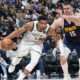 Milwaukee Bucks forward Giannis Antetokounmpo (34) drives past Denver Nuggets center Nikola Jokic (15) in the second half of an NBA basketball game Monday, Jan. 29, 2024, in Denver. (AP Photo/David Zalubowski)