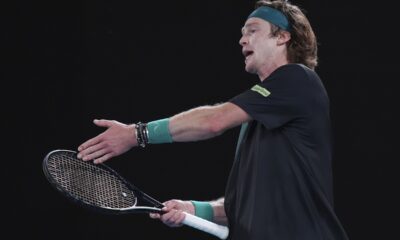 Andrey Rublev of Russia reacts after losing a point to Jannik Sinner of Italy during their quarterfinal match at the Australian Open tennis championships at Melbourne Park, Melbourne, Australia, Wednesday, Jan. 24, 2024. (AP Photo/Andy Wong)