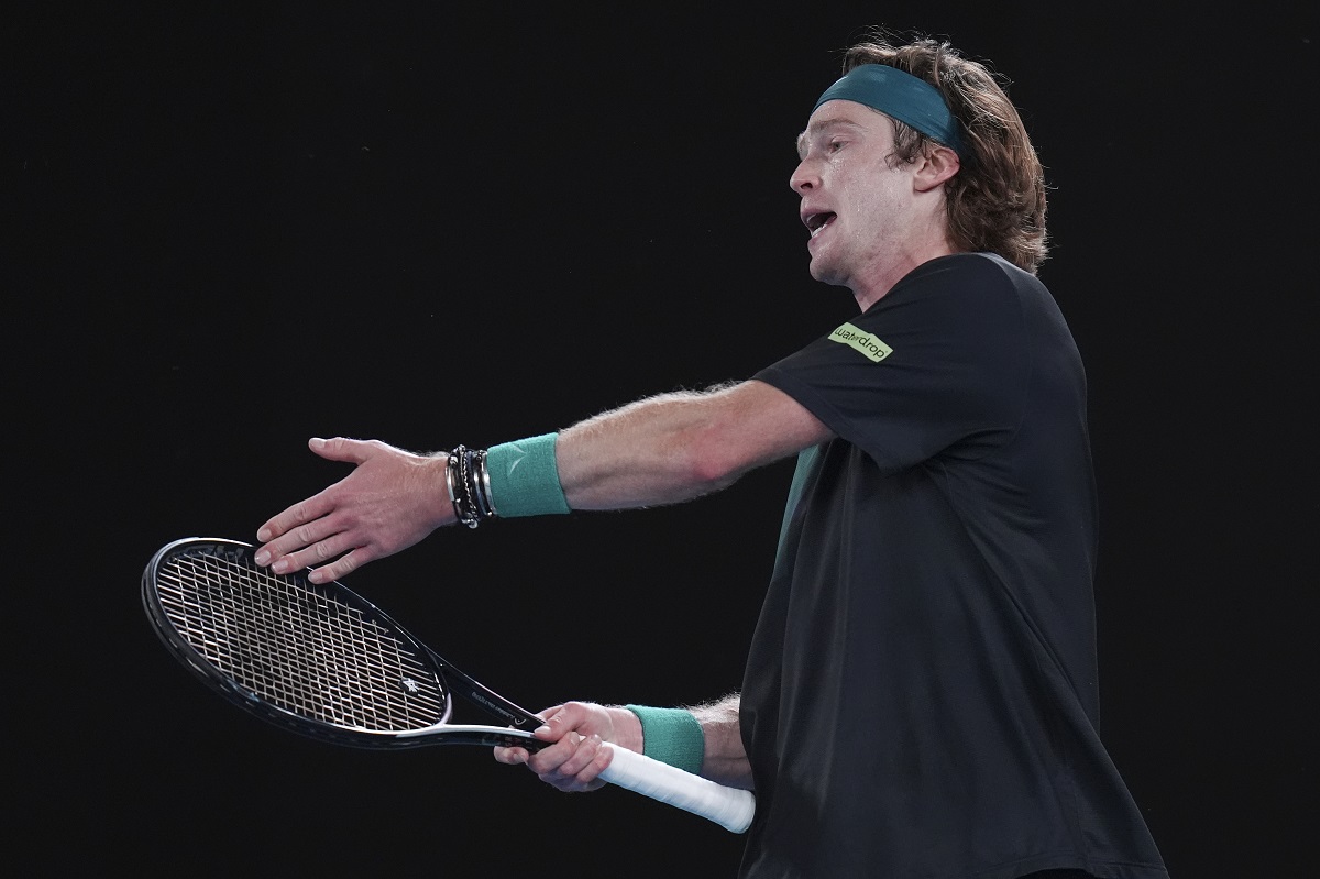 Andrey Rublev of Russia reacts after losing a point to Jannik Sinner of Italy during their quarterfinal match at the Australian Open tennis championships at Melbourne Park, Melbourne, Australia, Wednesday, Jan. 24, 2024. (AP Photo/Andy Wong)