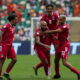 Equatorial Guinea's Emilio Nsue, centre, celebrates with his teammates after scoring his side's third goal during the African Cup of Nations Group A soccer match between Equatorial Guinea and Guinea Bissau, at the Alassane Ouattara Olympic stadium, in Abidjan, Ivory Coast, Thursday, Jan. 18, 2024. (AP Photo/Sunday Alamba)