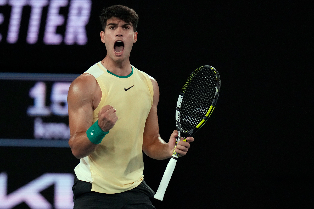 Carlos Alcaraz of Spain reacts after winning the first set against Richard Gasquet of France during their first round match at the Australian Open tennis championships at Melbourne Park, Melbourne, Australia, Tuesday, Jan. 16, 2024. (AP Photo/Andy Wong)