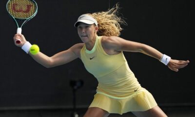 Mirra Andreeva of Russia plays a forehand return to Diane Parry of France during their third round match at the Australian Open tennis championships at Melbourne Park, Melbourne, Australia, Friday, Jan. 19, 2024. (AP Photo/Louise Delmotte)