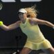 Mirra Andreeva of Russia plays a forehand return to Diane Parry of France during their third round match at the Australian Open tennis championships at Melbourne Park, Melbourne, Australia, Friday, Jan. 19, 2024. (AP Photo/Louise Delmotte)