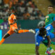 Ivory Coast's Nicolas Pepe, left, in action against Senegal's goalkeeper Edouard Mendy during the African Cup of Nations round of 16 soccer match between Senegal and Ivory Coast, at the Charles Konan Banny stadium in Yamoussoukro, Ivory Coast, Monday, Jan. 29, 2024. (AP Photo/Themba Hadebe)