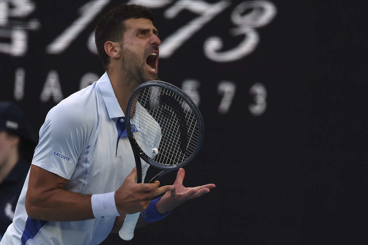Novak Djokovic of Serbia reacts after losing a point to Taylor Fritz of the U.S. during their quarterfinal match at the Australian Open tennis championships at Melbourne Park, Melbourne, Australia, Tuesday, Jan. 23, 2024. (AP Photo/Asanka Brendon Ratnayake)