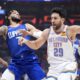 Oklahoma City Thunder guard Vasilije Micic, right, drives by Los Angeles Clippers guard Amir Coffey during the first half of an NBA basketball game Tuesday, Jan. 16, 2024, in Los Angeles. (AP Photo/Mark J. Terrill)