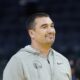 Golden State Warriors assistant coach Dejan Milojevic watches players warm up before an NBA preseason basketball game against the Denver Nuggets in San Francisco, Friday, Oct. 14, 2022. Warriors assistant coach Dejan Milojević, a mentor to two-time NBA MVP Nikola Jokic and a former star player in his native Serbia, died Wednesday, Jan. 17, 2024, after suffering a heart attack, the team announced. Milojević, part of the staff that helped the Warriors win the 2022 NBA championship, was 46. (AP Photo/Jeff Chiu)