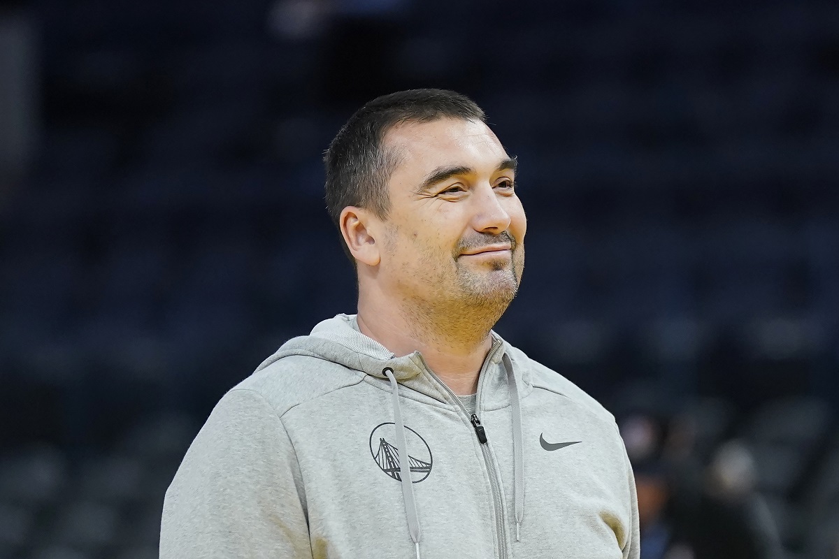 Golden State Warriors assistant coach Dejan Milojevic watches players warm up before an NBA preseason basketball game against the Denver Nuggets in San Francisco, Friday, Oct. 14, 2022. Warriors assistant coach Dejan Milojević, a mentor to two-time NBA MVP Nikola Jokic and a former star player in his native Serbia, died Wednesday, Jan. 17, 2024, after suffering a heart attack, the team announced. Milojević, part of the staff that helped the Warriors win the 2022 NBA championship, was 46. (AP Photo/Jeff Chiu)