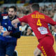 North Macedonia's Martin Velkovski, right, challenges France's Nikola Karabatic during the Men's European Handball Championship match between France and North Macedonia at the soccer stadium in Duesseldorf, Germany, Wednesday, Jan. 10, 2024. (AP Photo/Martin Meissner)