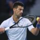 Novak Djokovic of Serbia serves to Tomas Martin Etcheverry of Argentina during their third round match at the Australian Open tennis championships at Melbourne Park, Melbourne, Australia, Friday, Jan. 19, 2024. (AP Photo/Asanka Brendon Ratnayake)