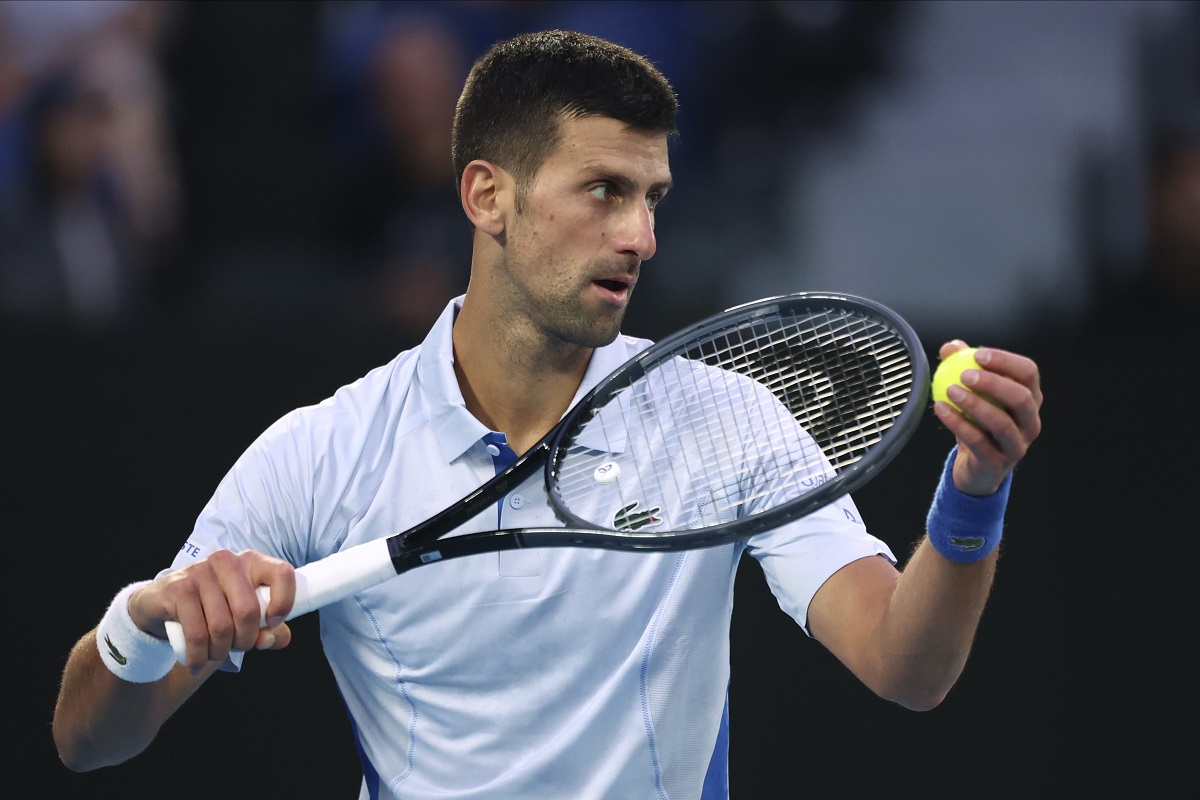 Novak Djokovic of Serbia serves to Tomas Martin Etcheverry of Argentina during their third round match at the Australian Open tennis championships at Melbourne Park, Melbourne, Australia, Friday, Jan. 19, 2024. (AP Photo/Asanka Brendon Ratnayake)