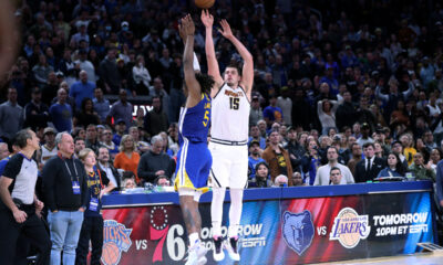 Denver Nuggets' Nikola Jokic hits a game-winning 3-pointer over Golden State Warriors' Kevon Looney during an NBA basketball game in San Francisco on Thursday, Jan. 4, 2024. (Scott Strazzante/San Francisco Chronicle via AP)