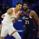 San Antonio Spurs' Victor Wembanyama, left, and Philadelphia 76ers' Joel Embiid struggle for position during the first half of an NBA basketball game, Monday, Jan. 22, 2024, in Philadelphia. (AP Photo/Matt Slocum)