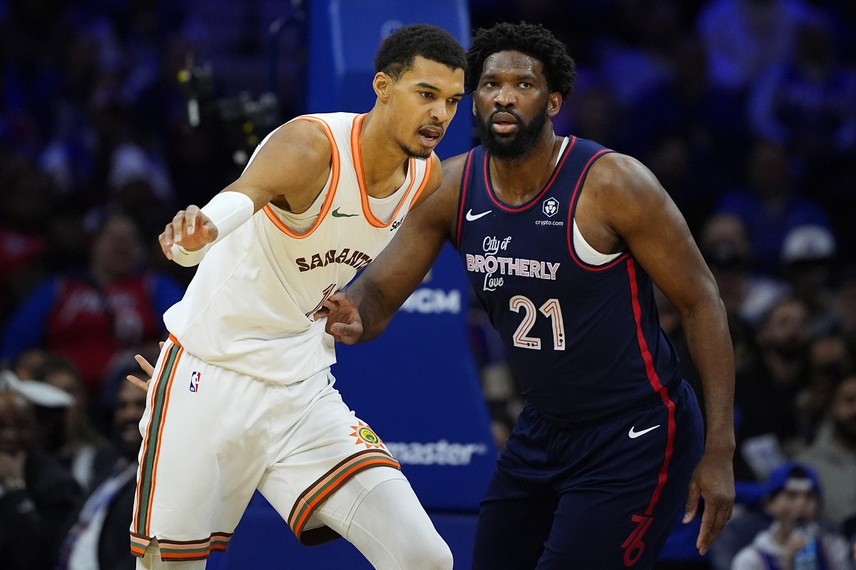 San Antonio Spurs' Victor Wembanyama, left, and Philadelphia 76ers' Joel Embiid struggle for position during the first half of an NBA basketball game, Monday, Jan. 22, 2024, in Philadelphia. (AP Photo/Matt Slocum)