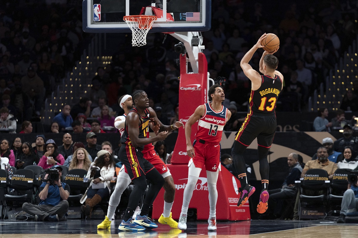 Atlanta Hawks' Bogdan Bogdanovic (13) shoots to the basket against the Washington Wizards during the first half of an NBA basketball game Sunday, Dec. 31, 2023, in Washington. (AP Photo/Jose Luis Magana)