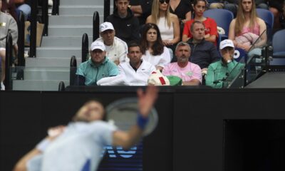 The team supporting Novak Djokovic of Serbia watch his third round match against Tomas Martin Etcheverry of Argentina at the Australian Open tennis championships at Melbourne Park, Melbourne, Australia, Friday, Jan. 19, 2024. (AP Photo/Asanka Brendon Ratnayake)