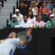 The team supporting Novak Djokovic of Serbia watch his third round match against Tomas Martin Etcheverry of Argentina at the Australian Open tennis championships at Melbourne Park, Melbourne, Australia, Friday, Jan. 19, 2024. (AP Photo/Asanka Brendon Ratnayake)