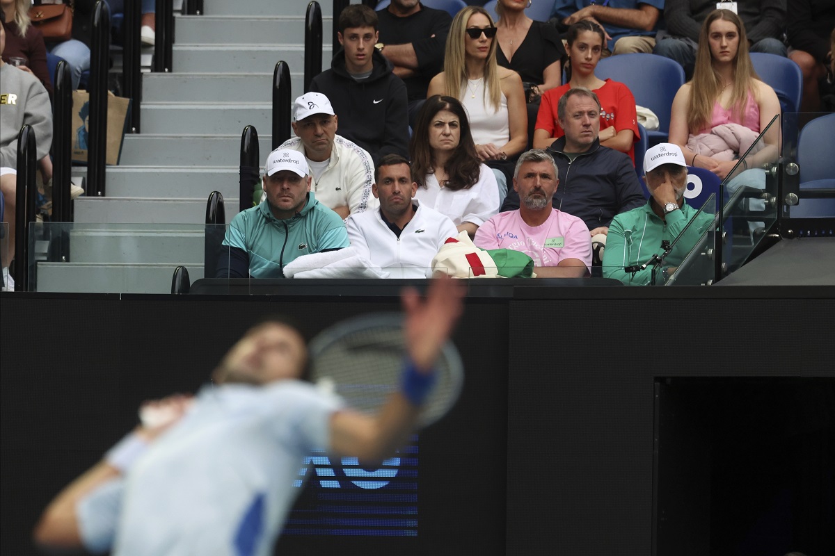 The team supporting Novak Djokovic of Serbia watch his third round match against Tomas Martin Etcheverry of Argentina at the Australian Open tennis championships at Melbourne Park, Melbourne, Australia, Friday, Jan. 19, 2024. (AP Photo/Asanka Brendon Ratnayake)