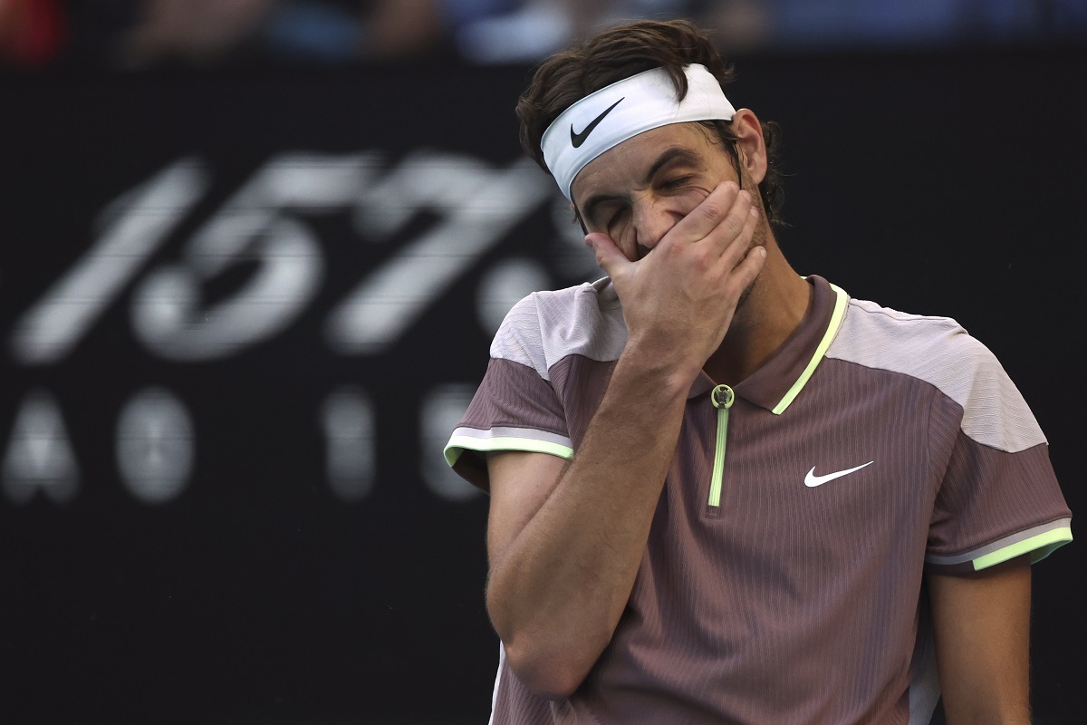 Taylor Fritz of the U.S. reacts during his quarterfinal against Novak Djokovic of Serbia at the Australian Open tennis championships at Melbourne Park, Melbourne, Australia, Tuesday, Jan. 23, 2024. (AP Photo/Asanka Brendon Ratnayake)