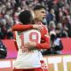 Bayern Munich's Aleksandar Pavlovic celebrates scoring his side's opening goal during the German Bundesliga soccer match between Bayern Munich and Borussia Moenchengladbach, at the Allianz Arena in Munich, Germany, Saturday, Feb. 3, 2024. (Angelika Warmuth/dpa via AP)