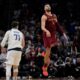 Cleveland Cavaliers guard Max Strus (1) watches his game-winning basket, next to Dallas Mavericks guard Luka Doncic (77) at the buzzer in an NBA basketball game Tuesday, Feb. 27, 2024, in Cleveland. (AP Photo/Sue Ogrocki)