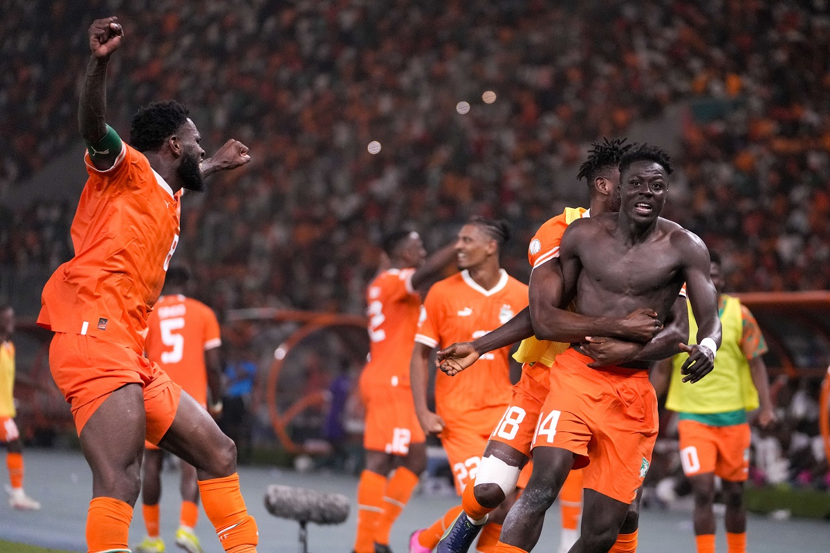 Ivory Coast 's Oumar Diakite, right, celebrates with teammates during the African Cup of Nations quarter final soccer match between Mali and Ivory Coast, at the Peace of Bouake stadium in Bouake, Ivory Coast, Saturday, Feb. 3, 2024. (AP Photo/Sunday Alamba)