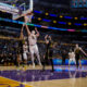 Denver Nuggets center Nikola Jokic (15) goes to the basket against Los Angeles Lakers forward Christian Wood (35) during the second half of an NBA basketball game in Los Angeles, Thursday, Feb. 8, 2024. (AP Photo/Eric Thayer)