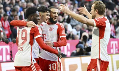 Bayern Munich's Aleksandar Pavlovic, 2nd left, celebrates scoring his side's opening goal with his teammates, from left, Alphonso Davies, Aleksandar Noussair Mazraoui and Harry Kane, during the German Bundesliga soccer match between Bayern Munich and Borussia Moenchengladbach, at the Allianz Arena in Munich, Germany, Saturday, Feb. 3, 2024. (Angelika Warmuth/dpa via AP)