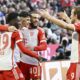 Bayern Munich's Aleksandar Pavlovic, 2nd left, celebrates scoring his side's opening goal with his teammates, from left, Alphonso Davies, Aleksandar Noussair Mazraoui and Harry Kane, during the German Bundesliga soccer match between Bayern Munich and Borussia Moenchengladbach, at the Allianz Arena in Munich, Germany, Saturday, Feb. 3, 2024. (Angelika Warmuth/dpa via AP)