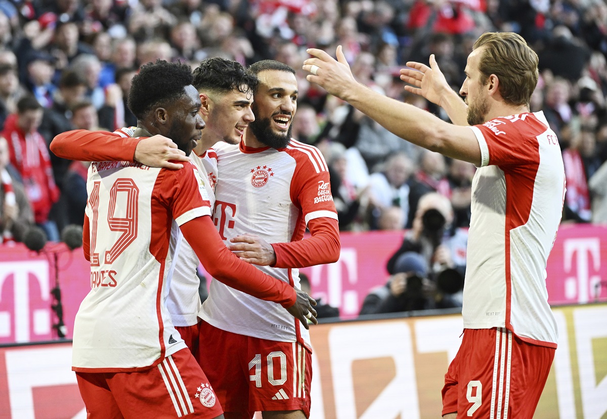 Bayern Munich's Aleksandar Pavlovic, 2nd left, celebrates scoring his side's opening goal with his teammates, from left, Alphonso Davies, Aleksandar Noussair Mazraoui and Harry Kane, during the German Bundesliga soccer match between Bayern Munich and Borussia Moenchengladbach, at the Allianz Arena in Munich, Germany, Saturday, Feb. 3, 2024. (Angelika Warmuth/dpa via AP)