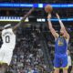 Golden State Warriors guard Klay Thompson (11) shoots a 3-point basket against Utah Jazz forward Taylor Hendricks (0) during the second half of an NBA basketball game Thursday, Feb. 15, 2024, in Salt Lake City. (AP Photo/Rick Bowmer)